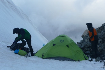 On the Annette Plateau, bunking down in another bit of weather. Having hauled out of Mount Cook with decently heavy packs, the freshness of our recent break evaporated. An appalling forecast would keep us away from our personal Ganges, South Westland’s Landsborough River. We had hoped to put up some unclimbed routes in that valley – undoubtedly some the finest remaining prospects to climb new stuff in true New Zealand style. This was a bitter disappointment to a group to whom Sprezzatura matters.