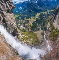 On our return we found another side trail just before the foot bridge leading right to the Jaws of Death. An easily negotiated but, at times, exposed staircase dropped down to a shelf where you can peer directly down the 500 or so metres of the upper portion of the Fall. Ooooweee. This image - Looking down upper Yosemite Fall. Part of the access trail is on the right, far below.