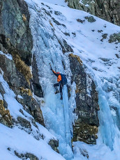 Then it was my turn. Even with the total safety of a top rope I still wasn’t sure if I’d be able to follow James. It was hard. My gear wasn’t as specialised for ice and nor was my technique – or lack of. By the time I’d smashed and grunted my way up 20 metres of vertical ice to the lip, where the gradient relented, my hands were numb and my muscles pumped to the extent that landing accurate axe placements had become a bit of a lottery. It was a relief to peer over the lip and see the rope leading up to a snow shelf not much further above, where James had set up a belay. This image by Kim Phongkaso.