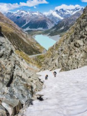 Up we went - initially steep scree, then 300 or so vertical metres of steep snow. By now the sun had caught up with us and, as we cramponed up, sweat poured off. The chute narrowed to a choke stone that I imagined could be a challenge in winter conditions, especially if descending.
