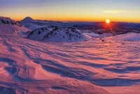 The first section up through Tukino Ski field was very straightforward – good terrain to generate some body heat for warmth. As we reached a ridge at about 2,000m on the north side, a molten orb breached the eastern skyline, treating us to some alpenglow on steroids. Otherworldly scalloped snow caught the low angled rays, creating a luxuriant scene at our feet that just stretched away to the horizon around us. Our route lay ahead, bathed in mauve. This image - A view from about 1,900m, north east to Ngauruhoe.