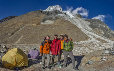 That night my bladder decided to torment me. Between lights out and departure for the summit at 2am it drove me from my sleeping bag nine times! After the first four Ed suggested I use our 1.5 litre water bottle rather than exiting the tent into sub-zero temperatures, which tended to kick start my now well entrenched dose of the Khumbu cough. Excellent idea. The next five pees nearly filled it. This picture, at base camp (5,000m) with Imja Tse behind.