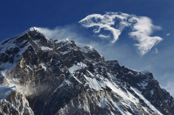 After Everest Base Camp we were pretty sure that our acclimatisation had gone well. Now it was time for the business end of the trek. Kami met us at Lobuje on the afternoon of Day eleven. He had arranged for Chhongbi, a 21 year old from his village below Lukla, to bring tents, cooking gear and food up from Chhukung, a village on the far side of Kongma La, the next day. Everything was in place and the good weather continued to hold. I could see that Ed was getting psyched up. He now knew how hard it is climbing above 5,000 metres, especially with a pack, so he knew his biggest challenge was now at hand. This picture, a view of fantastic cloud formations coming off Nuptse, from Lobuje.