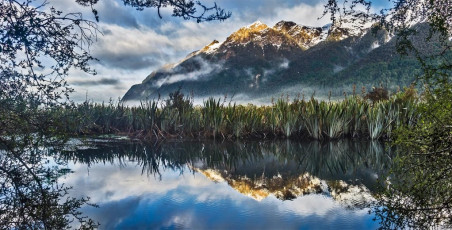On Friday morning a pleasant stop at the Mirror Lake on the way back to Te Anau, before all the tour buses started arriving, provided further joy for the photographer in me. Rain or shine, climbing or not, this is a part of New Zealand that cannot fail to impress. And if you’re an occasional climber like me, perhaps you should make a note in your diary for next July. Maybe I’ll see you there, but remember, spaces are limited.