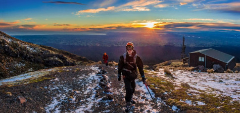 We set out at 8am as an orange sun broke through low clouds. The first couple of hundred metres were on rock and patchy snow, so I was keen that visibility was good for the boys as they became acquainted with those unfamiliar metal fangs strapped to their feet. They did well and we were soon at the bottom of the Lizard, spotting rime covered poles above.