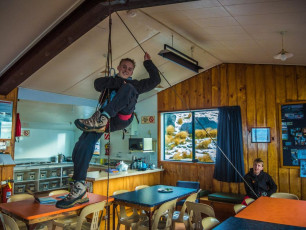 We were alone at the Lodge, so had plenty of room to practise roping up, prusiking, self-arrest body stance and harness and crampon installation. As we did this, outside the wind howled and sleet rattled. The first sign of an improvement was my Suunto registering a rise in barometric pressure. Then, in the early morning the wind dropped and the summit peeked through clearing cloud.
Looking good.