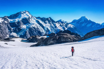 Day three we awoke to another calm, crystal clear morning. Our impression from the guide books was that we didn’t have anything challenging ahead of us. From the Plateau to Mueller Hut is only about 4km and a 400m drop in height. Mount Kitchener is graded a one. So at 10.30am, we set out in no particular hurry. Dropping across and down the Plateau into new and spectacular terrain was sheer enjoyment, but the closer we got to Kitchener the less assured we were about a nice safe route.