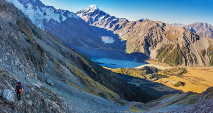 Upon reaching the slabs it became apparent that there was a way down to a snow field peppered with fallen rocks, which then led to tussocky shelves. Out of range of any airborne missiles at the bottom of the snow, we stopped for a breather, letting the tension we’d been feeling ease away. It had been a really insightful experience having to pick our own route without any prior instructions. While some people thrive on it, I don’t enjoy uncertainty; and when I feel real fear it’s probably a signal to myself that I’ve pushed it a bit too far. I learn more about my emotional limits each time I push my boundaries and Kitchener had unexpectedly done that. I may not like to admit it, but perhaps I’m learning that I’m more a photographer than a climber.