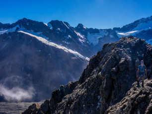 For a fleeting moment I dwelt on the PLB sitting in the top of my pack. No way, I’d never live that one down. Big breathes, map out, take stock. YES! There was a possible escape route down the east side. A chute dropped to slabs fifty metres or so below. They appeared to end in cliffs from where we stood, but the map suggested a better prognosis, so down we went.