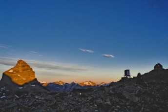 Pluto Peak, sunlit at dawn.
