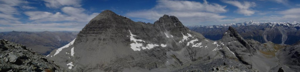 Summit view south from O'Leary Peak (2,570m) to Eanslaw East (2,830m, left) and Earnslaw West (2,820m, right). The route up Earnslaw East is all left of the snow field between the East and West peaks. Mounts Madeline and Tutoko are on the right skyline.