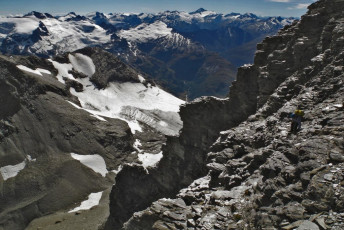 Finding the route through bluffs. Mount Aspiring is on the skyline right of centre.