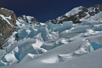 He knew that the sun was already weakening the bonds of thousands of tonnes of ice in the Gun Barrel, softening the snow on the steep slopes of the Linda Shelf and compromising the snow bridges over countless yawning crevasses on the Linda Glacier. The sooner we were past these the sooner we could relax.