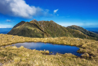 The tarn just above Arete Bivy, with Bannister and the Twins.