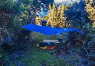 At about 1,200 metres, as we resignedly descended Shaun suddenly piped up again “That’s weird, I can hear trickling”. Indeed he had and soon, just before sunset, we’d strung up our fly right across the trail beside a tiny babbling brook on the ridge. It was a lovely way to finish the day. 