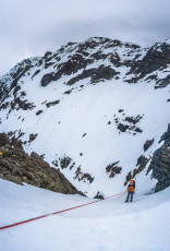At the ramp though Caro was unimpressed, as indeed was I. The ramp was no longer at all friendly, so Simon suggested another exit point further down the ridge. His option turned out to be partly friendly but, after running the ropes out to their full extent on a somewhat awkward abseil, Simon discovered that the next pitch was less friendly and also un-protectable. So back up he came and further down the ridge we went.