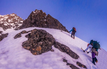 At about 1,500 metres we reached the snowline and soon donned our crampons. This is where our first problems emerged. Will’s crampons wouldn’t stay in place. I’d fitted them properly the night before, but I hadn’t done as well in fitting his feet to my spare trekking boots. There was just too much give and they kept popping off. As I cursed myself for my stupidity, Nina announced that she was not feeling well – possibly a dose of norovirus that had been doing the rounds recently. She was considering turning around and, when Ian heard all this, he also decided that perhaps our intended route might be a bit beyond his burning thighs on this particular dawn. 
So, as the first inkling of a new day began to backlight the St Arnaud Range across the valley, three headed back down to the hut and three continued up. I am eternally grateful to Nina and Ian for going down with Will. For a moment there I thought my climb was over before it had really started. And as we progressed higher, my gratitude only magnified as I realised that, on this day, the route would have been unacceptably dangerous for Will.