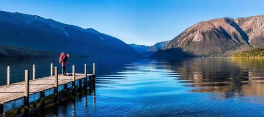 Our journey began on the Interislander two evenings before. Then our party was six – an Alpine Club trip led by Simon, our energetic Wellington Section President and organised by his industrious partner Caro. Nina, Ian and I are also Section members. I also had my youngest son Will along.   
Crossing Cook Strait we were still in a lovely weather window, due to close about midday on our intended summit day. The usual story authored by Mr Sod. A late night and fairly early start at St Arnaud saw us gliding across the mirror surface of Lake Rotoiti in Hamish’s water taxi just after 8am. With pretty hefty packs, even with the water taxi assistance, we still had a good 22kms to go to reach Upper Travers Hut, 700 vertical metres higher up.