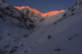 Next morning, before dawn under a crystal and starry sky, we made quick progress back along our track, until Steve started to struggle. Steve never struggles. He’s one of those quiet, totally dependable types that just gets on with it. But this morning he was suffering from a nasty dose of heart burn. Perhaps back at the pub the evening before, the giant pizza we ate, along with maybe an extra glass of vino than was smart, were taking their toll. Lesson number two – on a climb never discount the unlikely.