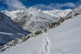 Back at Arthurs Pass we checked in with the Oracle, who concurred with what we had found – loads of unconsolidated snow requiring a bloody good freeze before we could get up much. So, next day we took it easy, had a couple of nice flat whites at the cafe and then went for a look-see up the Otira Valley. Fresh tracks didn’t extend far and soon we were knee deep and plugging our way over the bridge and on up to about 1,200m. We got a great view back to Mounts Temple and Phipps; and figured that this would set us up nicely for a climb tomorrow. Surely the now completely clear weather would see a good freeze over night. Surely!