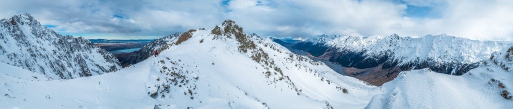 On the saddle we enjoyed an expansive panorama, taking in Mt Brown to our left, the cirque wall leading south to Mauka Atua, Dobson River valley, to our right and the Naumann Range, far right. A brief lunch stop was all we had time for – our chopper was due back at 4pm – nice.