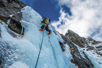 With youthful vigour James led up the hard, vertical ice. His experience told him not to rush it, otherwise his upper body would get over pumped and lactic acid laden muscles would translate in to fear. With frequent pauses to let the blood flow back into one arm then the next, he patiently made his way up the pitch, placing ice screw protection as he went.