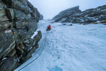 Paul Knott and James Hobson, Canterbury Section NZAC members and very capable technical climbers made up one rope. Piotr, also a good technical climber, kindly opted to lead the rookies - myself and his partner Kim, who had never been in crampons. After establishing a belay stance at the base of the steep ice we enjoyed climbing a 60 metre pitch.