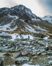 Our chopper touched down beside Bush Stream at 1,150 metres, about 1pm next day. We immediately set up camp and geared up. Looking north, up the flanks of Mount Brown, we could see some near vertical white lines extending upwards from the steep sloping scree - worth a look. This image - Across Bush Stream, climbing onto the flanks of Mt Brown (2,168m) to the north.