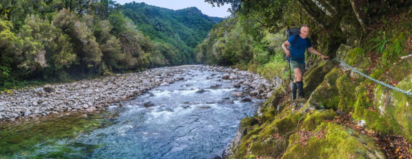 The following day was similar as we carried on down river, past Crow Hut (330m) to Karamea Bend Hut (280m).
On our sixth day the rain began to set it. It was time to climb again, up to Baton Saddle over a 1,000 metres above. The previous two days had allowed us to rejuvenate, but we still weren’t quite prepared for what confronted us on the lower section of the climb to the Saddle. This image - The Karamea River, not far from Venus Hut.