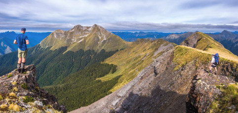 At the saddle beneath Patriarch Darryn and Steve decided to go directly on to Kiwi Saddle while Shaun and I scampered pack less, up the 340 metres between us and Patriarch’s summit at 1,701m. On top we enjoyed superb 360 degree views and an opportunity to eyeball much of our intended route. We joined the others down at Kiwi Saddle Hut (1,000m) for lunch. The weight of our packs now played on our minds as we prepared to head on up again to a 1,400m saddle beneath Mount Luna. This image - On the Arthur Range, looking to Mt Patriarch (1,701m right and 1,692m left). The third lower peak is the site of a trig at 1,600m.