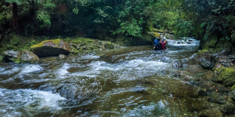 There isn’t that much of New Zealand’s back country Shaun’s boots haven’t trodden, but his planned eight day route in the Kahurangi National Park would take him to some new territory. The entire route was new for me. Our entry point would be Baton Valley Road, heading over Baton Saddle to Karamea River, then up again over Sandy Peak and the Herbert Range, down and around the base of Mount Kendall to Trevor Carter Hut, up again to Biggs Tops, down to Stone Hut, up and over to Kiwi Saddle, up Mount Patriarch and then along the Arthur Range as far as John Reid Hut, finally exiting via the Wangapeka River Road. Quite a hike. Joining us were two of Shaun’s long time hill buddies Darryn Pegram and Steve Baker. Three of us are very keen photographers. Darryn used to be too but these days he’s happy to leave his camera gear behind. He became our super model, stalked by the paparazzi at every photogenic spot. This image - Shaun and Darryn making one of many crossings on our way out.