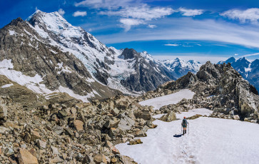Here was my next surprise. Simon and Caro had talked this down as a fairly easy section of the route. Though not as steep as parts of the western side, much of Ball Ridge is exposed and crumbling. Lots of little undulations and sub ridges to lead us astray, especially as it was hard to stay focused when the views unfolding around me were so beautiful. Aoraki’s Caroline Face dominated the scene, but the views up Tasman Glacier were also compelling. This image - Heading down the ridge at about 2,000m, with the Caroline face of Aoraki Mt Cook left.