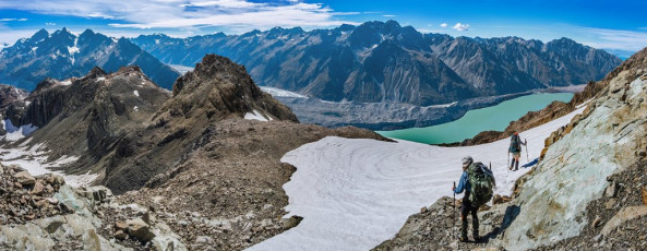 But on the eastern side of the range there was no respite from the glaring sun. Stupidly I had not sufficiently slip-slop-slapped the day before and had to wear my fleecy to cover up my sunburned arms. Sweating took on a new meaning for me as we worked our way onto and along Ball Ridge. This image - Departing the camp site, with Tasman Lake and the ridge that the Ball Pass route traverses on the eastern side.
