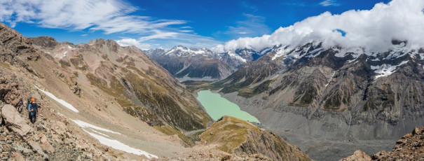 A little above that, at about 1,600m, a large rocky plain called the Playing Field came into view, with Mount Mabel looming over head. Here, again, route finding demanded care. The key is to remember to keep left/north. A zigzag Z trail leads up about 100m to Mabel’s northwest ridge crest which, once we rounded, gave us our first view of Ball Pass. And it didn’t disappoint, looking very much a mountain pass. This image - Ascending the middle section of the western side Ball Pass route, with Hooker Lake below.
