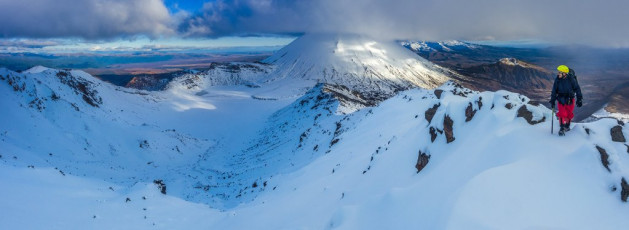 Our route left the main trail down at Mangatepopo Hut (1,190m) the afternoon before, crossing the stream and following the ridge all the way to Tongariro’s rime encrusted summit (1,967m). I’d been this way only a week before, but things had changed – for one the snowline had receded from about 1,250m to 1,650m. On my last visit we couldn’t see much, but now we were trudging in to a period of the most settled weather in weeks. With no snow I noted this time how, even here, a much more discernible path has been worn. We’d reached the summit a little before sunset, leaving enough time to find a suitably sheltered camp site, set up camp and heat water for dinner. This image - On our way up on the first afternoon, on Tongariro's summit (1,967m), with Ngauruhoe (2,287m) behind.