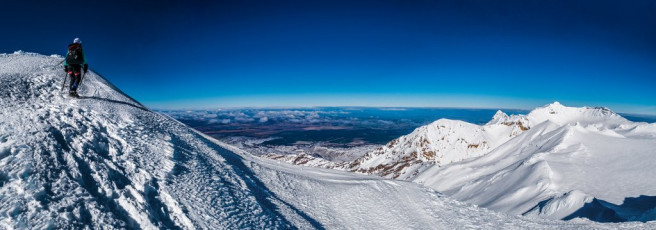 Kathy and I reached the top soon after, enjoying an unimpeded panorama. There’s so much more to Ruapehu’s terrain than “volcano” suggests. We enjoyed this until the wind drove us down to the saddle between Te HeuHeu and Tukino. As we did so, two figures appeared from where we’d come up earlier, scampered up the final stretch to Te HeuHeu’s summit, then disappeared. This image - Approaching the summit of Te HeuHeu (2,732m).