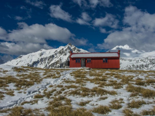 From your home, you can fly to Queenstown, pick up a rental car, pop in to the supermarket for supplies, drive to Fantail Falls car park and ascend to the Hut, or even on to the top of Mount Armstrong, in a day. This image - Brewster Hut, with Top heavy (left) and Mt Brewster (right) behind