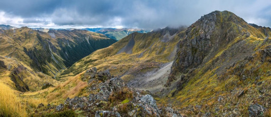 Back down in the snug shelter of the Tardis we enjoyed many brews, several forms of chocolate and then another good sized dinner as we waited to see what the weather would bring. If it improved we hoped to sidle around ledge systems to have a crack at the 1,700m Grand Duchess. In the craggy but open terrain there are many options open in every direction, at least if conditions permit. This image - A view from the 1,674m high point to the west of Brass Monkey Biv. Here looking south west down the valley leading to the Christabel Track
