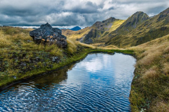 Although the weather hadn’t been conducive to any serious climbing, clearings in the clag during the afternoon encouraged us out to explore the terrain around the Biv. More tarns cropped up as we wandered over the folds in the landscape.