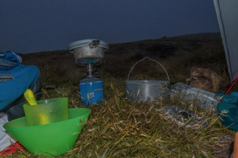 Sometime after dark the rattling of rain on our tent fly didn’t sound encouraging. The weather system had arrived even faster than forecast and, next morning we agreed that there was little point trying to climb treacherous, slippery rocks into viewless soaking clag. At least Brass Monkey Biv offered small scale shelter a few hours walking, over 1,643m Lucretia.