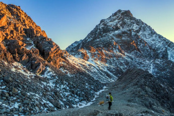 We were away a little before dawn, reasoning that we needed daylight before the notch so we could accurately assess the conditions above. I paced myself as James patiently and uncomplainingly ignored my spluttering. We reached Travers Saddle at dawn and our way ahead, along the south ridge, was painted in warm hues. The photographer in me rejoiced. This image - Gaining the South Ridge, just above Travers Saddle