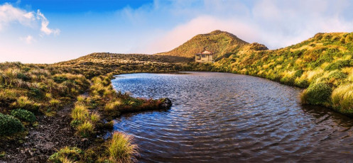 Maungahuka Hut and it's tarn, with Maungahuka (1,330m) behind