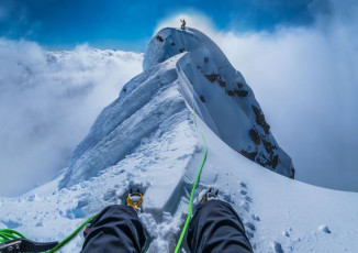 Piotr enjoying having reached the true summit, viewed from my belay stance