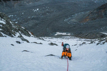 At 1,500m the glacier gives way to steep scree. For us the top of this was snow covered, allowing for quicker down climbing to begin with. Once the snow thinned though, the going got treacherous. Then it began snowing as the last light of day faded and a biting wind picked up. Which brings me back to our freezing bivvy.
This image - The steep chute leading down to the scree beneath Boys Glacier.