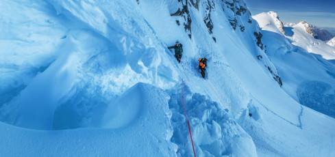 We reached the schrund after about two and half hours of tiring plugging. I managed to lead across on the climber’s right, but it was immediately apparent that the snow was in horrid condition and protecting ourselves as we climbed, or more importantly descended, was going to be near impossible. ‘I don’t like it guys.’ ‘Just go a bit further and see if the snow improves’ Simon encouraged. Up I went, then Caro crossed the schrund and, 15 metres of rope later, so did Simon – not that the rope provided any real protection as three effectively unanchored climbers wallowed upwards. After a failed attempt to put in a rock anchor at about 2,400 metres, we all agreed that this wasn’t going to be our day.