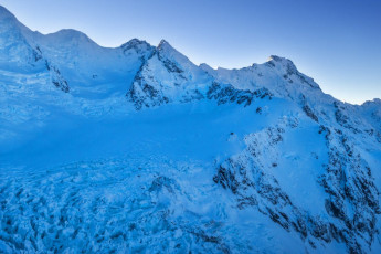 On the Tuesday, two days before, Simon Williamson, his partner Carolyn Ellis and I had taken a chopper up to Plateau Hut. Our Wellington Section NZAC trip objective was the standard east ridge route on Mount Dixon. The forecast for the following day was bluebird and avalanche risk was rated low. But the weather window was short, with a deterioration expected on Thursday afternoon. Unless things improved, our plan was to climb on Wednesday and walk out Thursday. This image - Approaching the Grand Plateau. Hochstetter icefall is bottom left, Mt Dixon centre skyline and Plateau Hut the dot at centre right.