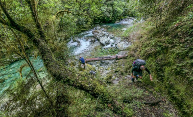 Our exit was north, tracing the left branch of Wairoa River to the Wairoa Gorge Road end. The first couple of hours scrambling up and down a steep, narrow, root infested, storm damaged trail kept us on our toes. At a tributary stream signalling the end of the rough stuff we paused to drink. ‘I reckon we found the sweet spot on this trip’ I reflected. ‘Five huts all to our selves, dramatic photography and a nice bit of cramponing up on Rintoul.’ ‘And it wouldn’t have been much fun at Arthurs Pass this week either’ replied Shaun. ‘Just awesome’ added Robbie.
This image - Beside the Wairoa River, about 2 hours north of Mid Wairoa Hut.