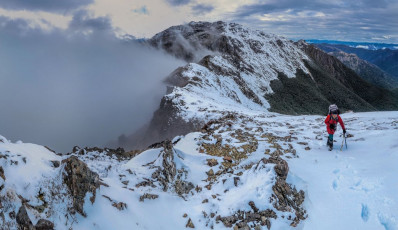 Beyond the ‘crux’ is a steep drop of over 250 metres, followed by a taxing 300 metre snow plug up the other side to the summit of Mount Rintoul (1,731m). ‘It’s classic type one fun – physical but not scary; and beautiful scenery’ I enthused between gulps of breath. 
This image - At about 1,550m, looking back to Little Rintoul, from above the dip on the east side of Mt Rintoul.