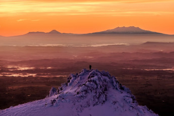 Next morning was even better. If you’re a photographer, a Syme Hut dawn should be on your bucket list.
This image - Looking east, across Fantham's Peak, at dawn to, from left, Mounts Tongariro, Ngauruhoe and Ruapehu.